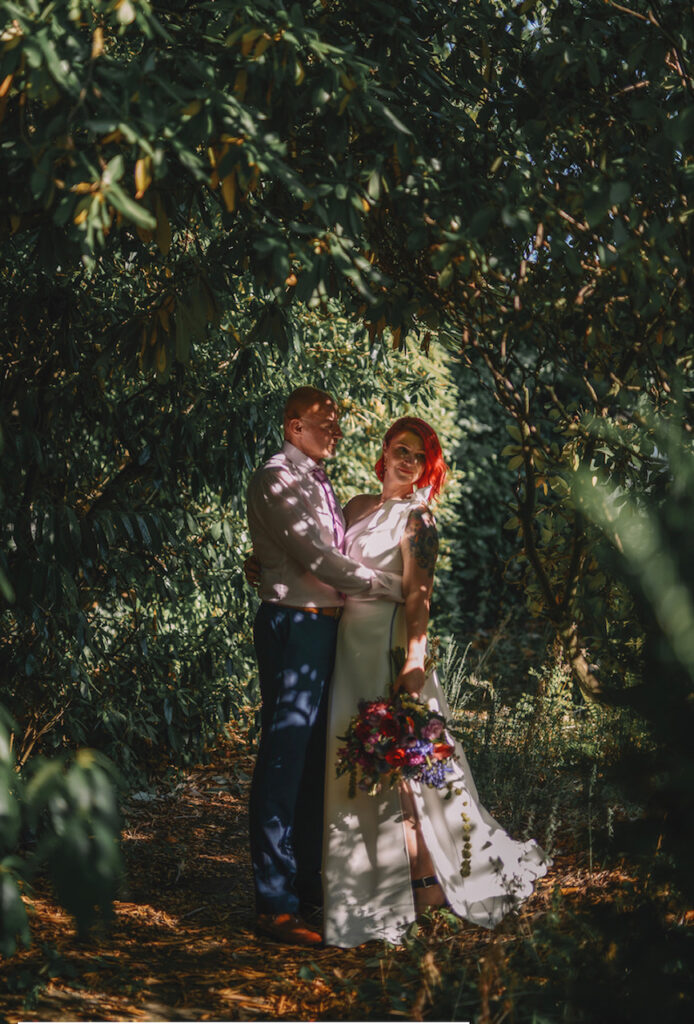 A couple under a tree at Lincolnshire wedding venue The Elm Tree