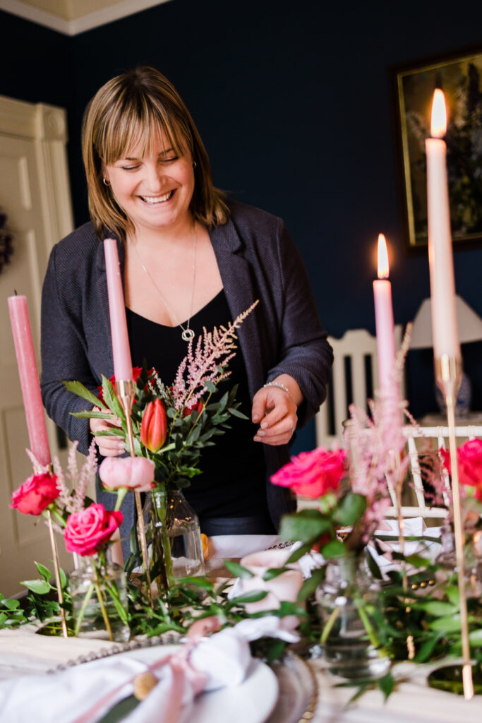 Niki from The Elm Tree lighting a candle on a wedding day morning.